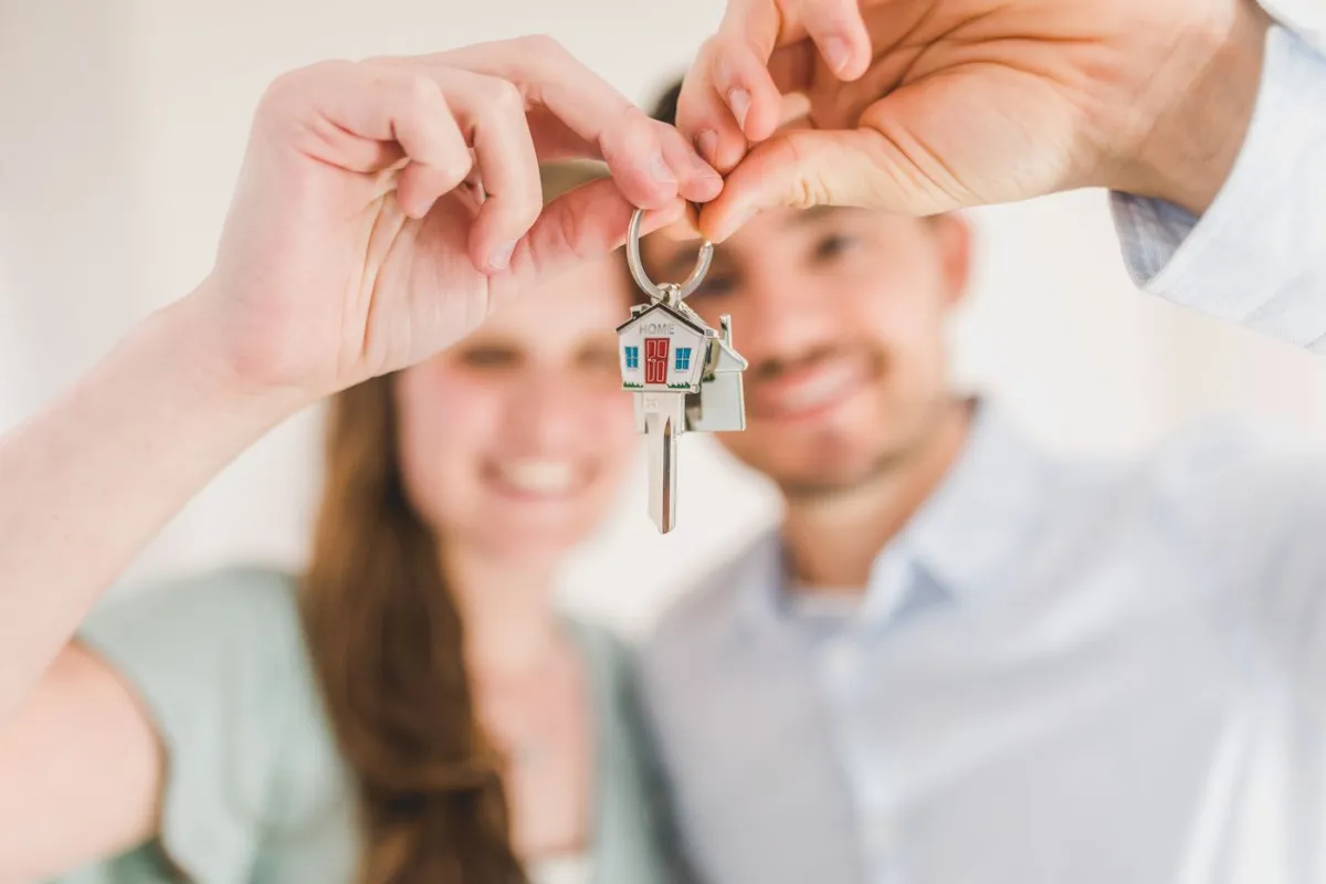 First-time buyer outside their new home