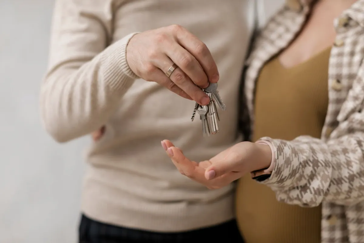 First-time buyer outside their new home